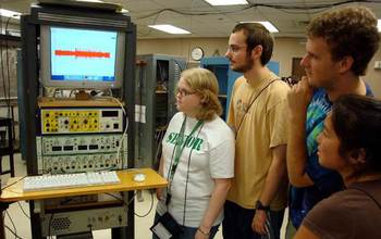 group of students with scientific equipment